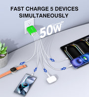 Compact USB C charger block powering multiple devices including iPhone and MacBook.