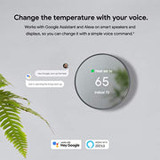 Google Nest Thermostat mounted on a wall in a modern home setting."