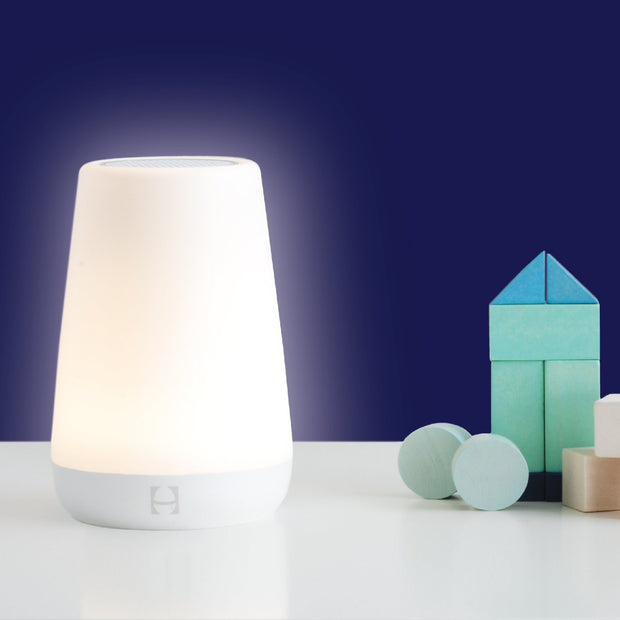 Hatch Rest night light in a cozy nursery setting with soft glow