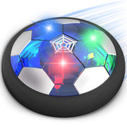 Air-powered soccer ball gliding across a hardwood floor with bright LED lights.