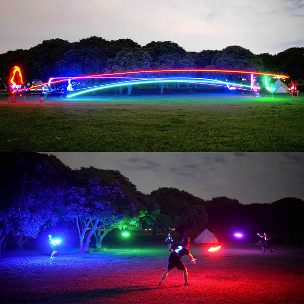 TOSY light-up disc glowing brightly in outdoor night play.